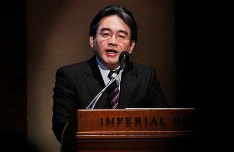 Nintendo President Satoru Iwata speaks as he unveils a Nintendo