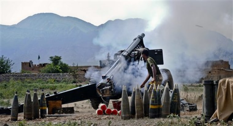 A Pakistani army soldier fires an artillery shell toward a target at a forward base during a military operation against militants in Pakistan's Khurram tribal region, Saturday, July 9, 2011.  \"A military operation in Kurram tribal region has been launched to clear the area of terrorists involved in all kinds of terrorist activities, including kidnapping and killing of locals, suicide attacks and blocking the road connecting Lower with upper Kurram,\" Pakistani army spokesman Maj. Gen. Athar Abbas  said. (AP Photo/Mohammad Zubair)