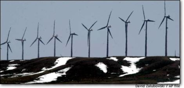 Windmills line a ridge on a ranch along the Colorado-Wyoming border, south of Cheyenne, Wyo. Wind farms are cropping up all over the interior West as companies turn to alternative sources of energy in the face of rapidly rising demand.