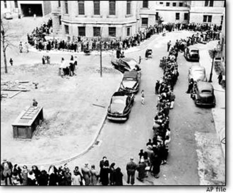 That was then: In April 1947, people stand in line waiting to be inoculated against smallpox at the Morrisania Hospital in New York.