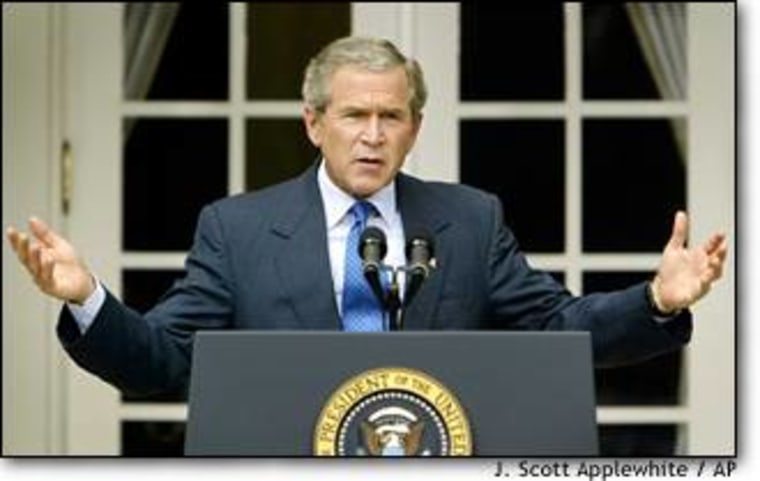 President Bush responds to a reporter's question during a news conference in the Rose Garden at the White House.