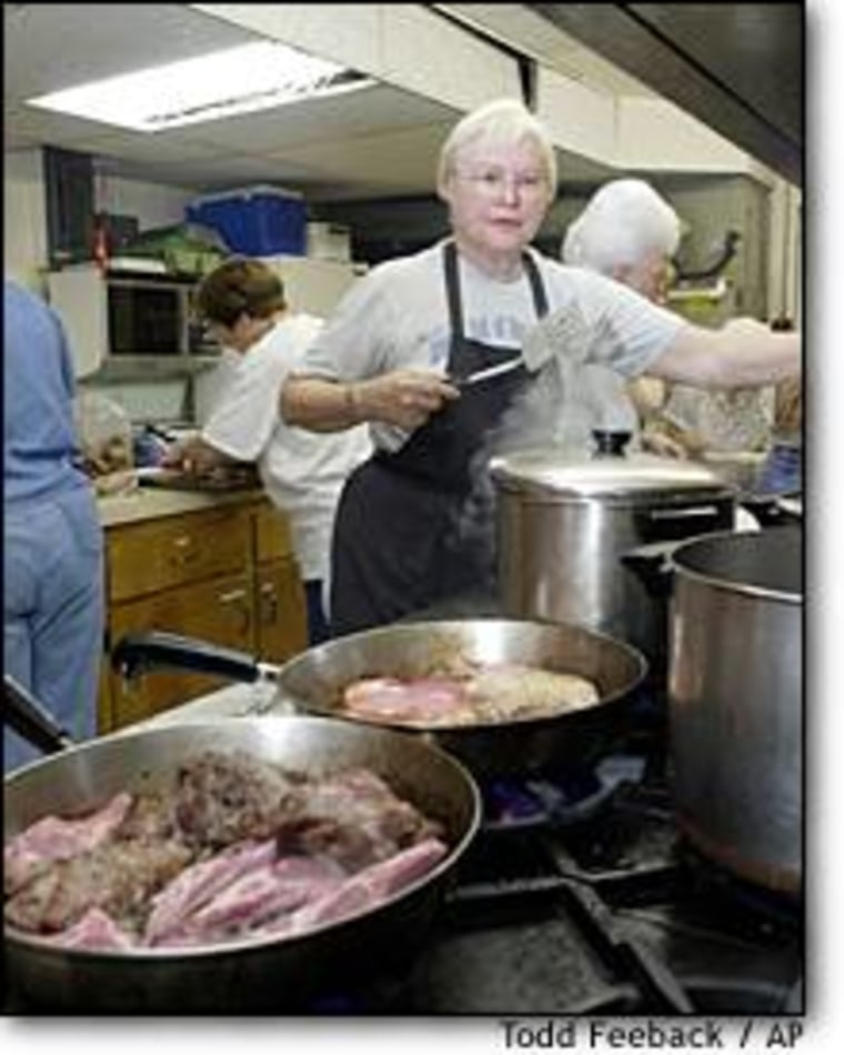 Betty Roberston of Belton, Mo., helps cook food in the basement kitchen of the Belton United Methodist Church on May 16. Volunteers cook the food which is then taken to the FDA food laboratory in Lenexa, Kan., for testing.