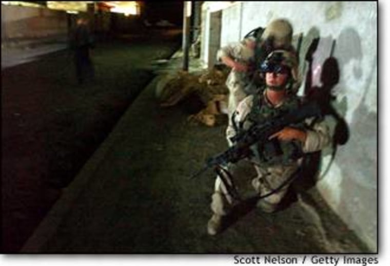 4th Infantry Division soldiers conduct a nighttime patrol of the city center in Samarra, Iraq.