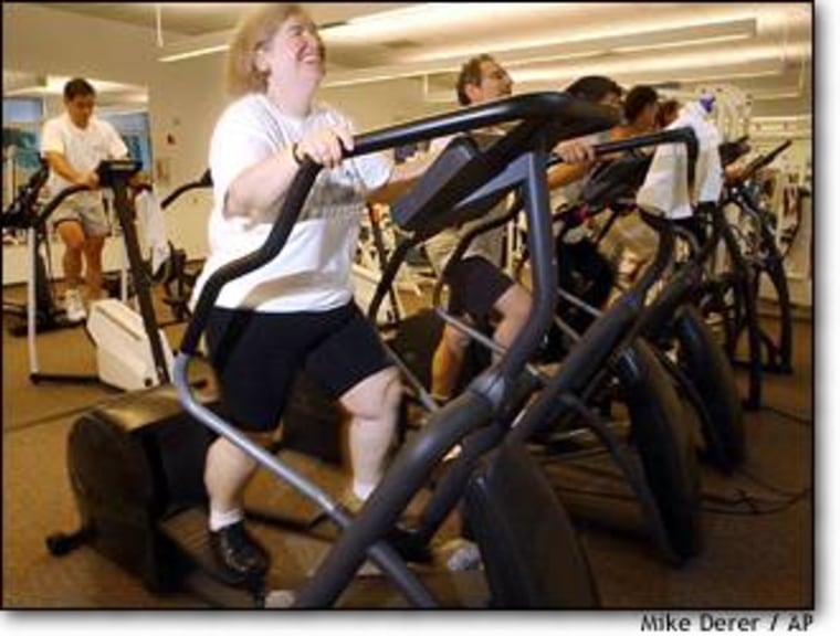 Ellen Lipschitz, a scientist at Hoffman-La Roche pharmaceutical company, works out at the corporation's fitness center in Nutley, N.J., on Aug. 5. Lipschitz has lost 93 pounds through the company's weight-loss programs.