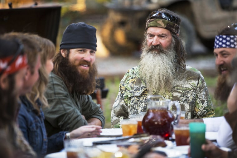Phil Robertson, flanked by his sons Jase and Willie, on the series \"Duck Dynasty.\"
