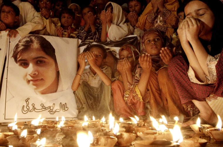 Pakistani children pray for the recovery of 14-year-old schoolgirl Malala Yousufzai during a candlelight vigil in Karachi, Pakistan, Friday.