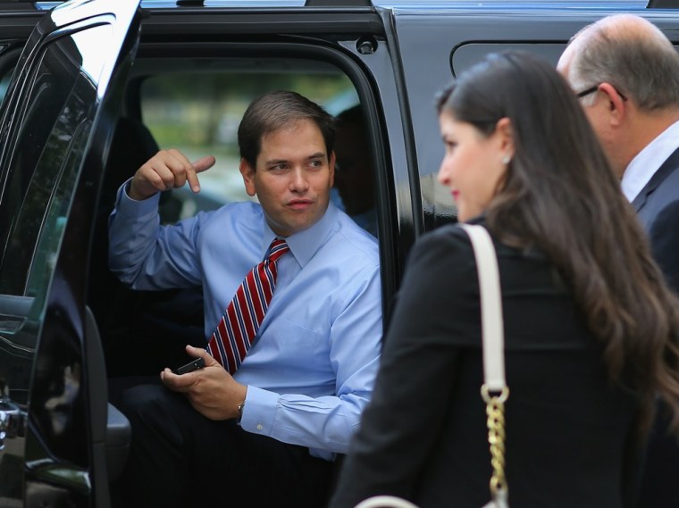 Sen. Marco Rubio (R-FL) waits in his vehicle for the arrival of Craig Romney, the son of Mitt Romney, Romney campaign rally at Florida International University in Miami, Florida. on October 12, 2012.
