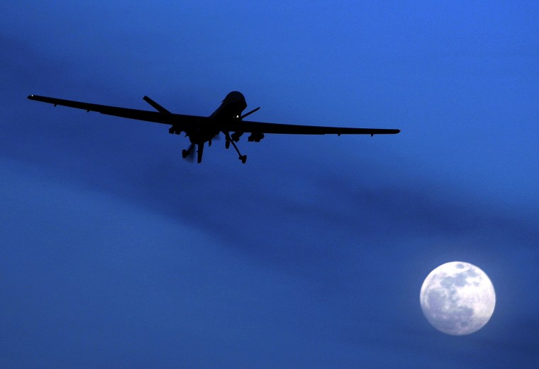 In this Jan. 31, 2010 file photo, an unmanned U.S. Predator drone flies over Kandahar Air Field, southern Afghanistan, on a moon-lit night. (Photo: AP Photo/Kirsty Wigglesworth)