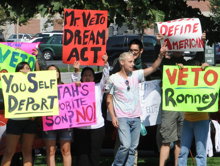 Latino protesters march by the hotel where Republican presidential candidate Mitt Romney is scheduled to attend a fundraising event in Salt Lake City, Utah, September 17. (Nicholas Kamm/AFP/Getty Images)