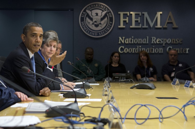 President Barack Obama, accompanied by Homeland Security Secretary Janet Napolitano, second from left, and others, speaks about superstorm Sandy during a visit to the Federal Emergency Management Agency (FEMA) Headquarters in Washington, Wednesday, Oct...