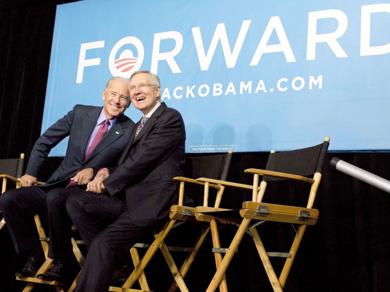Vice president Joe Biden, left, and Senate Majority Leader Harry Reid of Nev. react to cheers from the crowd at campaign a rally, Thursday, Oct. 18, 2012, in Las Vegas. (Photo: AP Photo/Julie Jacobson)