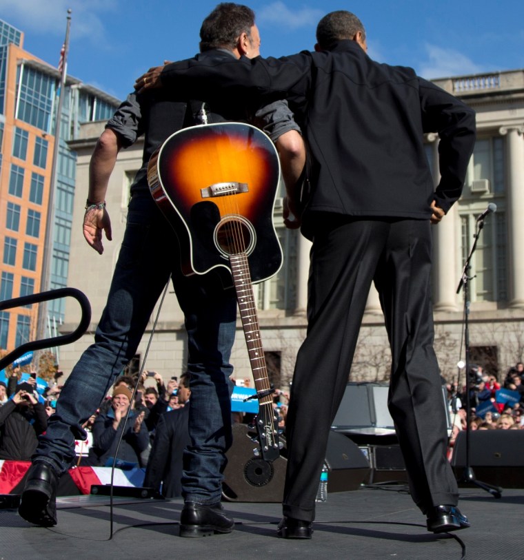 President Barack Obama and singer Bruce Springsteen stand together on stage during a campaign event, Monday, Nov. 5, 2012, in downtown Madison, Wis. (AP Photo/Carolyn Kaster)