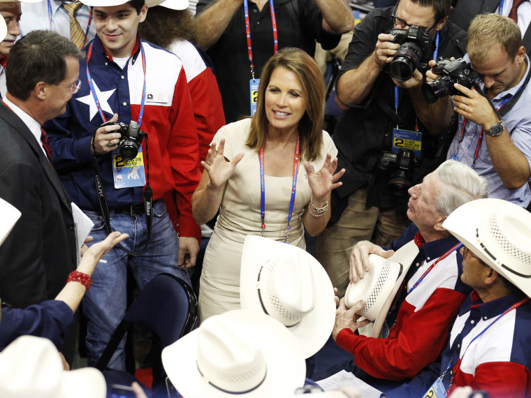 U.S. Rep. Michele Bachmann talks with members of the Texas delegation on the floor of the during the second session of the 2012 Republican National Convention in Tampa, Florida August 28, 2012. (Photo by Joe Skipper/REUTERS)