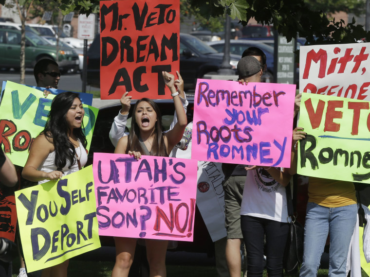 Immigration activists protest outside of The Grand America in Salt Lake City, Utah, where Republican presidential candidate and former Massachusetts Gov. Mitt Romney is holding a campaign fundraising event, Tuesday, Sept. 18, 2012.  (Photo by Charles...