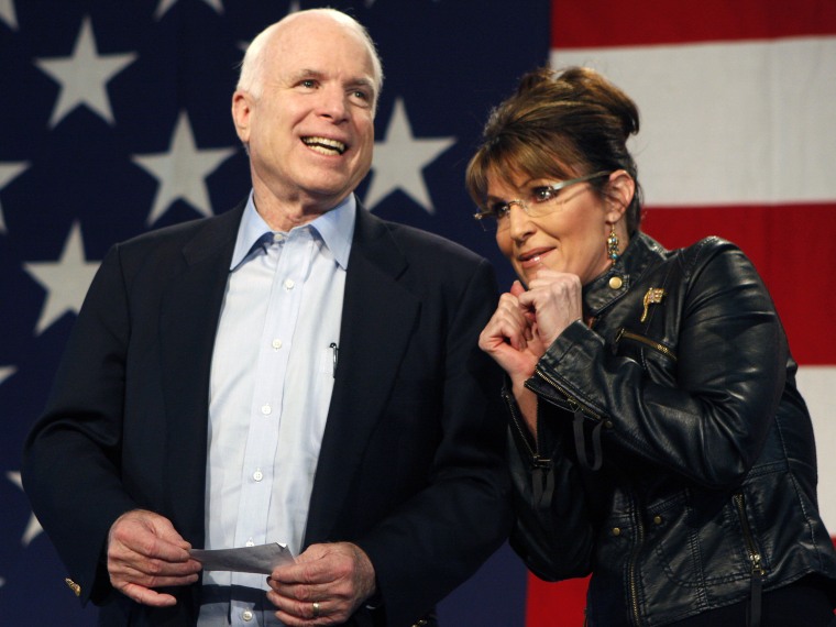Senator John McCain and former Alaska governor and vice presidential candidate Sarah Palin during a campaign rally at the Pima County Fairgrounds in Tucson, Arizona March 26, 2010. (Photo by Joshua Lott/Reuters)