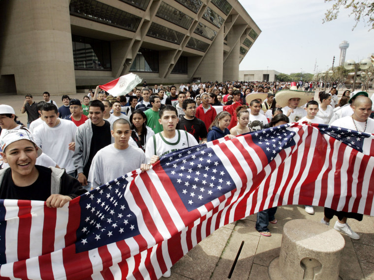 File Photo: Thousands of high school students march in front of city hall in Dallas, Tuesday, March 28, 2006. Thousands of students walked out of class and converged on City Hall to protest immigrant legislation in Congress.    (Photo by AP Photo/Tony...