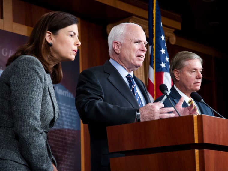 US Senators John McCain(C) (R-AZ), Lindsey Graham(R) (R-SC) and Kelly Ayotte (R-NH) hold a press conference (Photo by Karen Bleier/AFP/Getty Images)