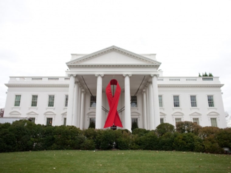 A red ribbon is displayed on the North Portico of the White House, Nov. 30, 2010, in advance of World AIDS Day. (Official White House Photo by Lawrence Jackson)