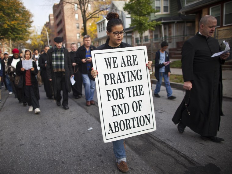 File Photo: A woman holds a sign during an anti-abortion protest march to the Choices Women's Medical Center in Queens, New York October 20, 2012. The protest was organized by local church, Presentation of the Blessed Virgin Mary and targeted the...