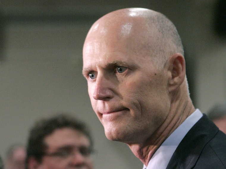 File Photo: Gov. Rick Scott expresses his disappointment about the supreme court's decision concerning the health care bill at a news conference on Thursday, June 28, 2012, in Tallahassee, Fla.   (Photo by Steve Cannon/AP Photo File)