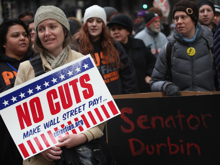 Protestors call for an increase of taxes on the wealthy and voice opposition to cuts in Social Security, Medicare, and Medicaid during a demonstration in the Federal Building Plaza on December 6, 2012 in Chicago, Illinois.  About 300 protestors...