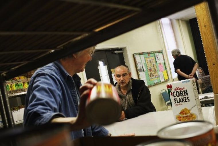 File Photo: READING, PA -A man chooses groceries at the Central Park United Methodist Church weekly food pantry on October 19, 2011 in Reading, Pennsylvania. The church feeds thousands of needy Reading residents monthly and relies on donations and...