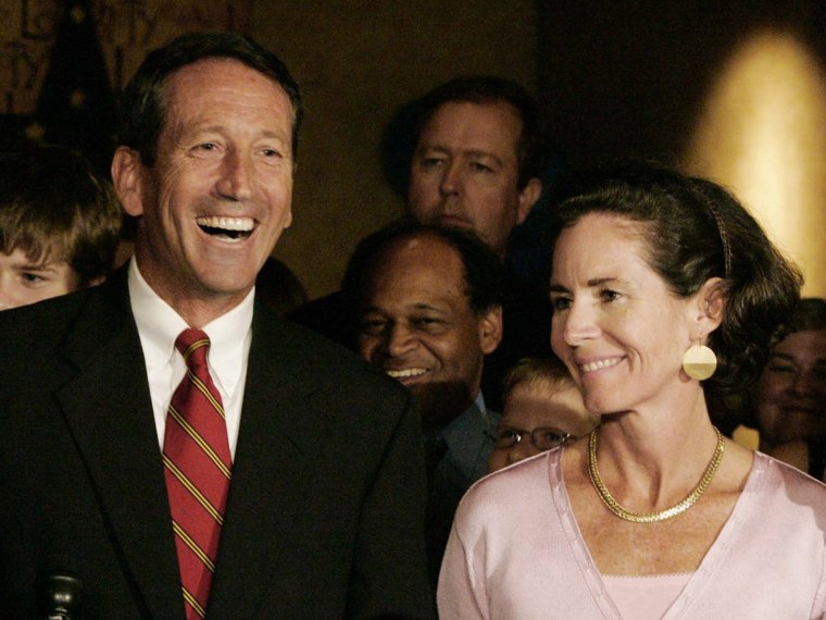 File Photo: In this file photo taken June 13, 2006 S.C. Gov. Mark Sanford smiles as he is joined by his wife, Jenny, after he won the Republican gubernatorial nomination in Columbia, S.C. (Photo by Mary Ann Chastain/AP Photo/File)