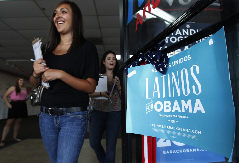 Volunteers for President Barack Obama's reelection campaign as they work to register new voters while they canvass a heavily Latino neighborhood shopping plaza. Both political parties have been courting the Latino vote, the nation's fastest-growing...
