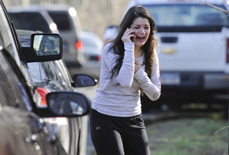 Carlee Soto waits to hear about her sister, a teacher, following the shooting. (Photo by Jessica Hill/AP Photo)