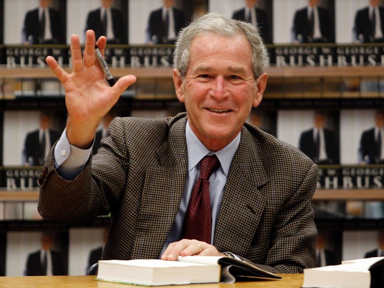 File Photo: Former U.S. President George W. Bush waves while signing copies of his new memoir \"Decision Points\" at Borders Books on November 9, 2010 in Dallas, Texas. (Photo by Tom Pennington/Getty Images/File)