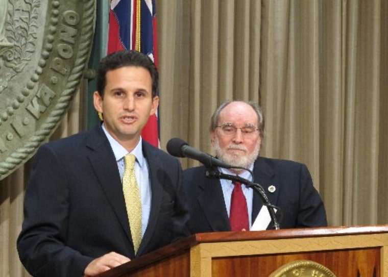 Hawaii Lt. Gov. Brian Schatz speaks the state Capitol in Honolulu on Wednesday, Dec. 26. 2012 after Gov. Neil Abercrombie, right, announced he was appointing Schatz to fill the seat vacated by the late U.S. Sen. Daniel Inouye. (AP Photo/Audrey McAvoy)