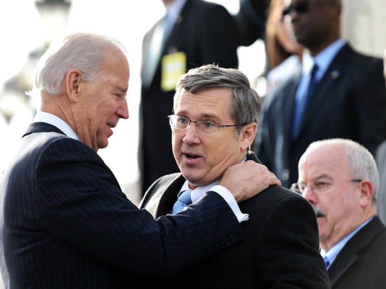 US Vice President Joe Biden (L) greets Illinois Senator Mark Kirk upon his return to the Senate on January 3, 2013 after suffering a stroke last January. On Tuesday, Kirk announced his support for marriage equality. (Photo by Jewel Samad/AFP/Getty Images)