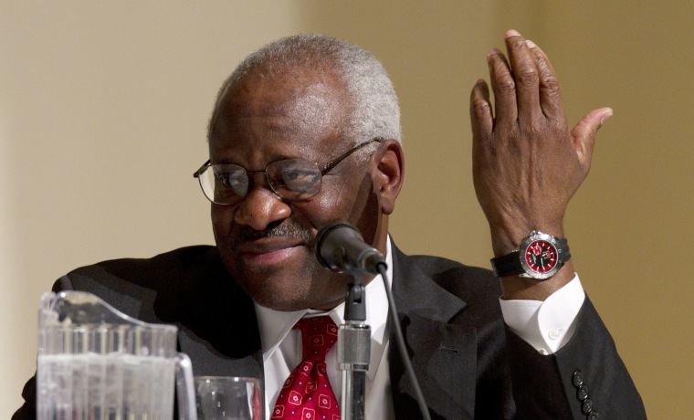 Supreme Court Justice Clarence Thomas gestures while taking part in a panel discussion at College of the Holy Cross in Worcester, Mass., Thursday, Jan. 26, 2012. (Photo by Michael Dwyer/AP)