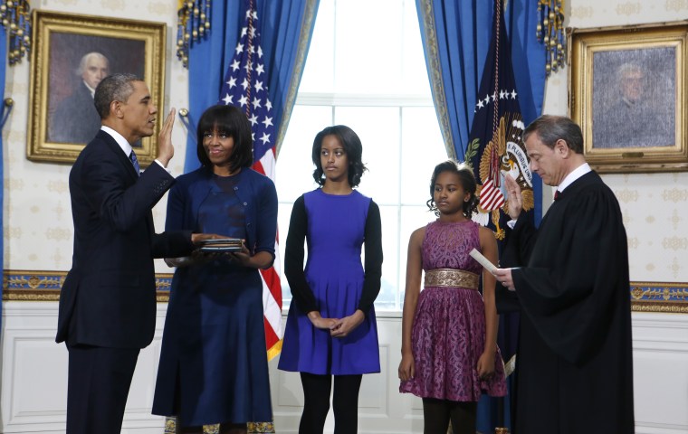 President Barack Obama is officially sworn-in by Chief Justice John Roberts in the Blue Room of the White House during the 57th Presidential Inauguration in Washington, Sunday Jan. 20, 2013. Next to Obama are first lady Michelle Obama, holding the...