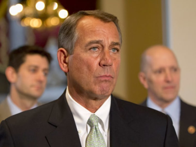 House Speaker John Boehner of Ohio, flanked by House Budget Committee Chairman Rep. Paul Ryan and House Ways and Means Committee Chairman Rep. Dave Camp, speaks during a news conference on Capitol Hill in Washington, Wednesday, Jan. 23, 2013. (Photo by...