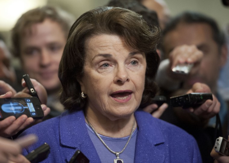 Senate Intelligence Committee Chair Sen. Dianne Feinstein, D-Calif., is surrounded by reporters on Capitol Hill in Washington, Friday, Nov. 16, 2012, following a closed-door hearing of the committee where former CIA Director David Petraeus testified. ...
