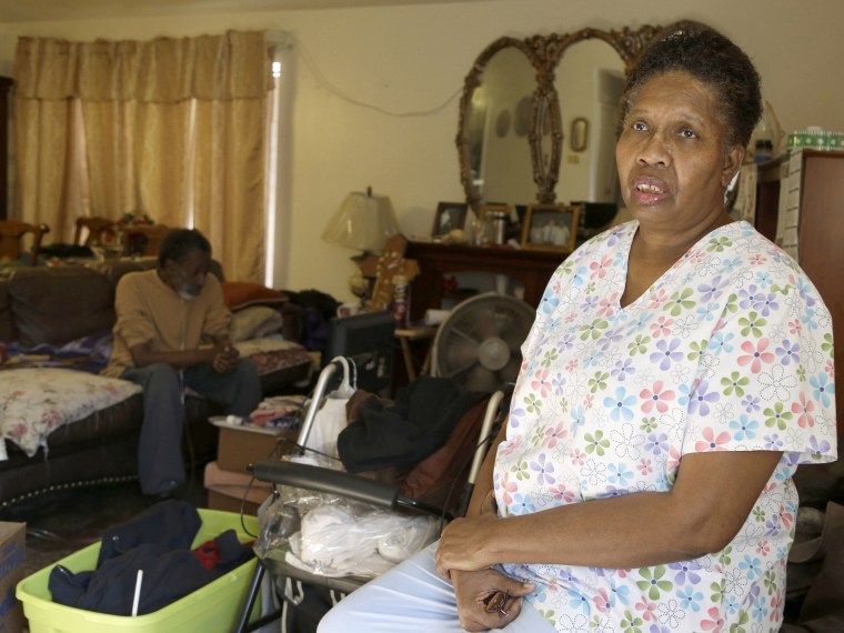 Part-time home health care provider Debra Walker in her home in Houston. She had a good job with health insurance until she got laid off in 2007.  (Photo by Pat Sullivan/AP Photo)