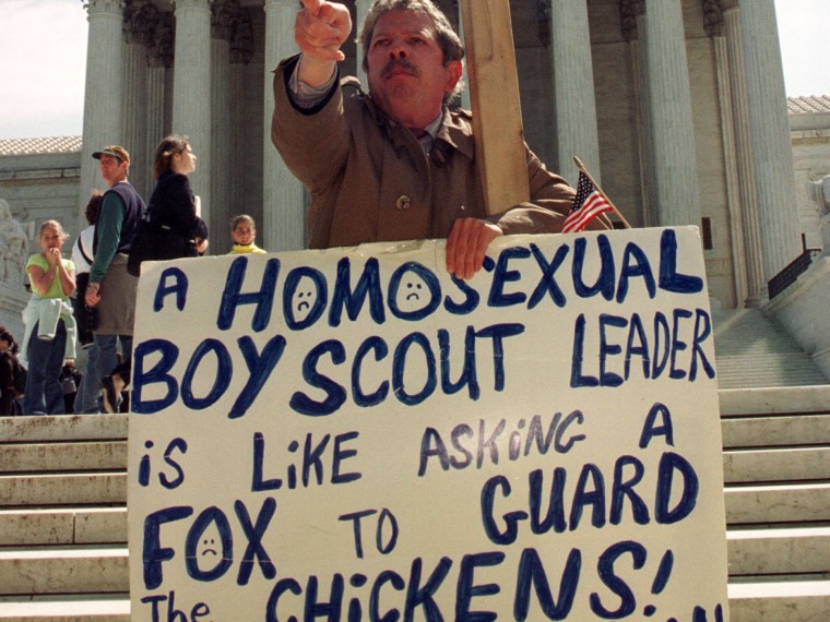 File Photo: Daniel Martino protests outside the Supreme Court as justices hear arguments in the case of New Jersey Boy Scout leader James Dale April 26, 2000 in Washington, DC. The Supreme Court heard arguments on whether the Boy Scouts have a...
