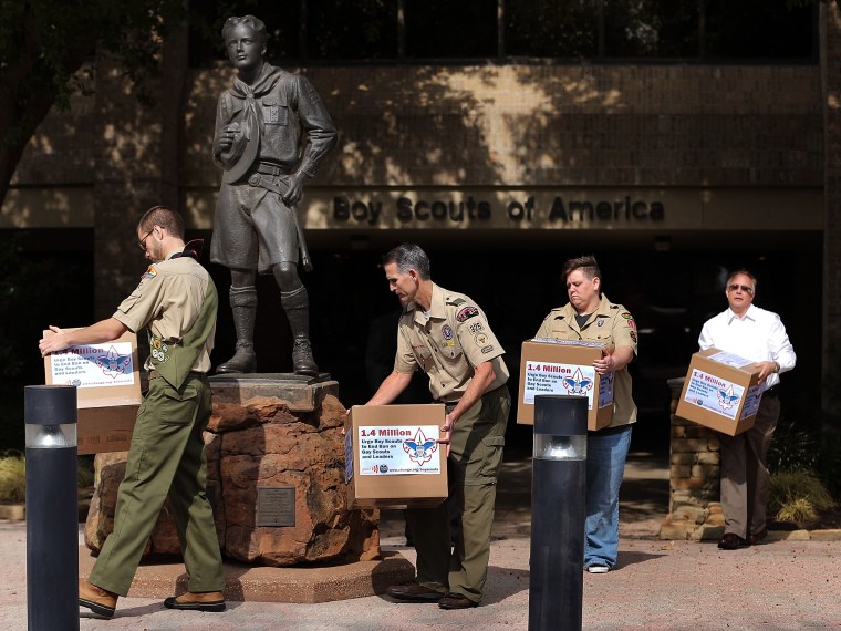 (L-R) Will Oliver, Eagle Scout , Greg Bourke, former Assistant Scoutmaster, Jennifer Tyrrell, former Cub Scout Den Mother, and Eric Andresen, former Scout leader, deliver boxes containing 1.4 million signatures urging the Boy Scouts of America to...