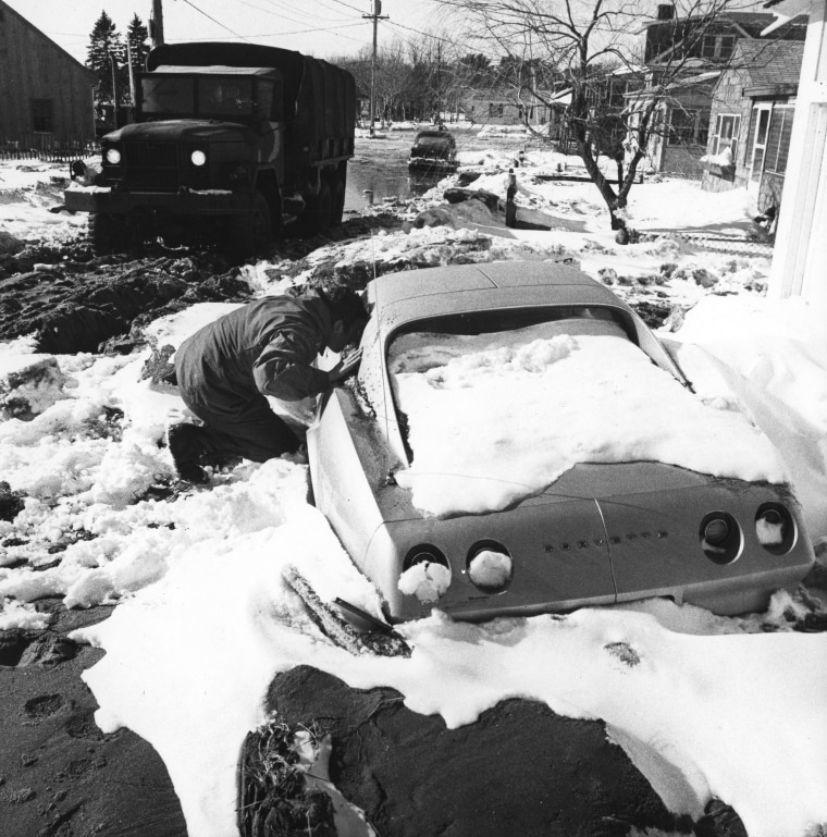 ** FILE ** ADVANCE FOR SUNDAY FEB. 2 ** A National Guardsman checks a stranded car Feb. 9, 1978, in Hampton, N.H., after the Blizzard of '78 to see if anyone was trapped inside. A winter storm combined with high tides flooded the New Hampshire seacoast...
