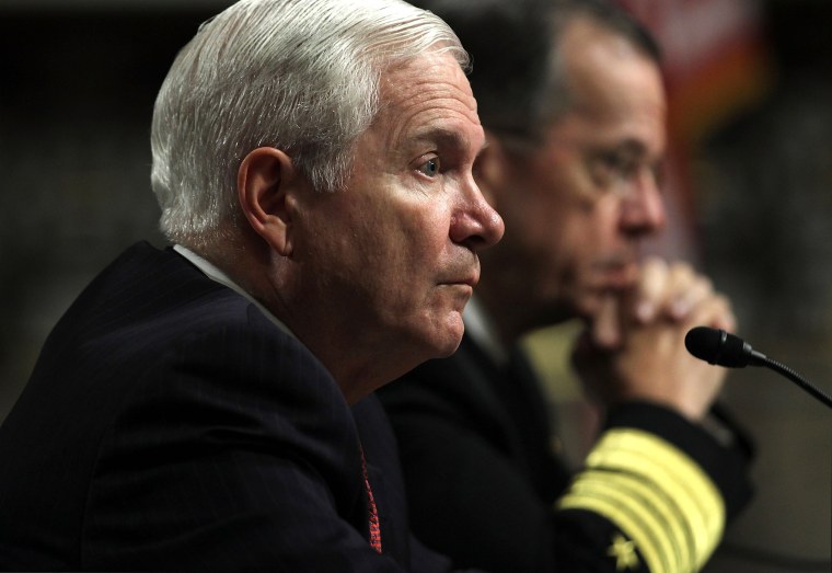 U.S. Secretary of Defense Robert Gates (L) and Chairman of the Joint Chiefs of Staff Admiral Mike Mullen (R) testify during a hearing before the Senate Armed Services Committee March 31, 2011 on Capitol Hill in Washington, DC. The hearing was to...