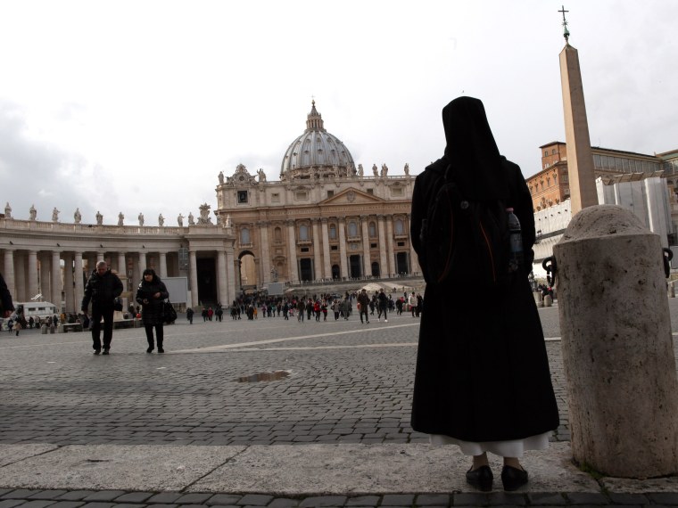 A nun walks in St. Peter's Square on February 11, 2013 in Vatican City, Vatican. Pope Benedict XVI today announced that he is to retire on February 28 citing age related health reasons. (Photo by Franco Origlia/Getty Images)