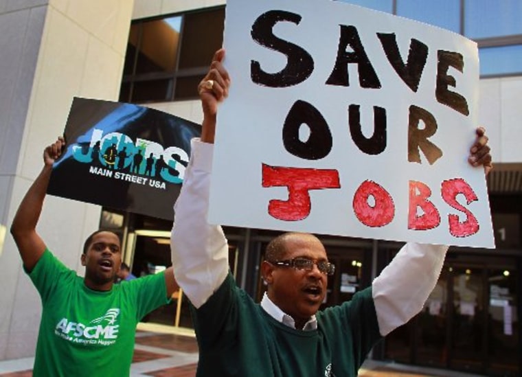 Robert Glover (R), Local 199 AFSCME union president, joins a protest against Florida Gov. Rick Scott's state budget proposal announced on February 7, 2011 in Miami, Florida. (Photo by Joe Raedle/Getty Images)