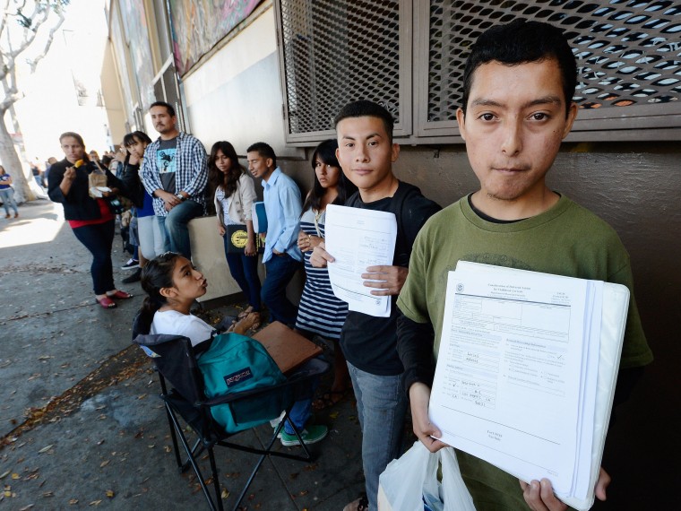Roberto Larios, 21, holds Deferred Action for Childhood Arrival application as he waits in line with hundreds of fellow undocumanted immigrants at the Coalition for Humane Immigrant Rights of Los Angeles offices to apply for deportation reprieve on...