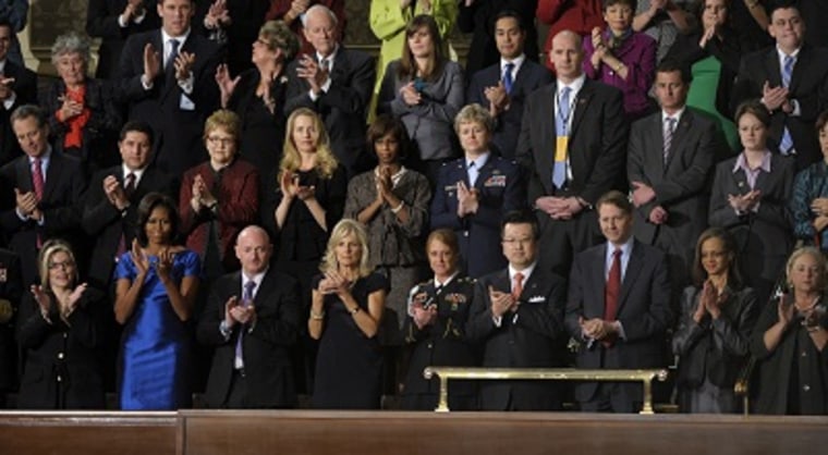 First lady Michelle Obama and guests applaud during President Barack Obama's State of the Union address on Jan. 24, 2012. (Photo by Susan Walsh/AP)