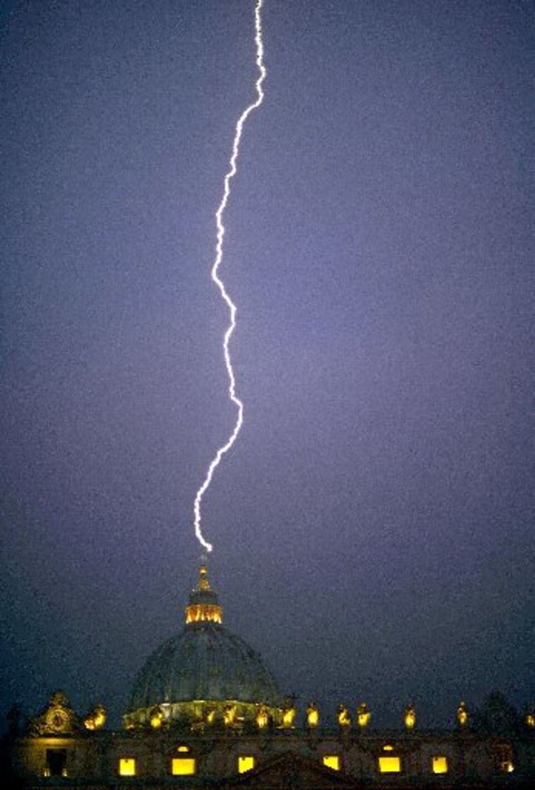A lightning strikes St Peter's dome at the Vatican on February 11, 2013. Pope Benedict XVI announced today he will resign as leader of the world's 1.1 billion Catholics on February 28 because his age prevented him from carrying out his duties -- an...