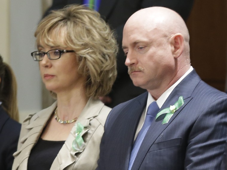 Former Arizona Rep. Gabrielle Giffords and her husband Mark Kelly watch President Barack Obama's State of the Union address during a joint session of Congress on Capitol Hill in Washington, Tuesday Feb. 12, 2013. (Photo by Pablo Martinez Monsivais/AP...