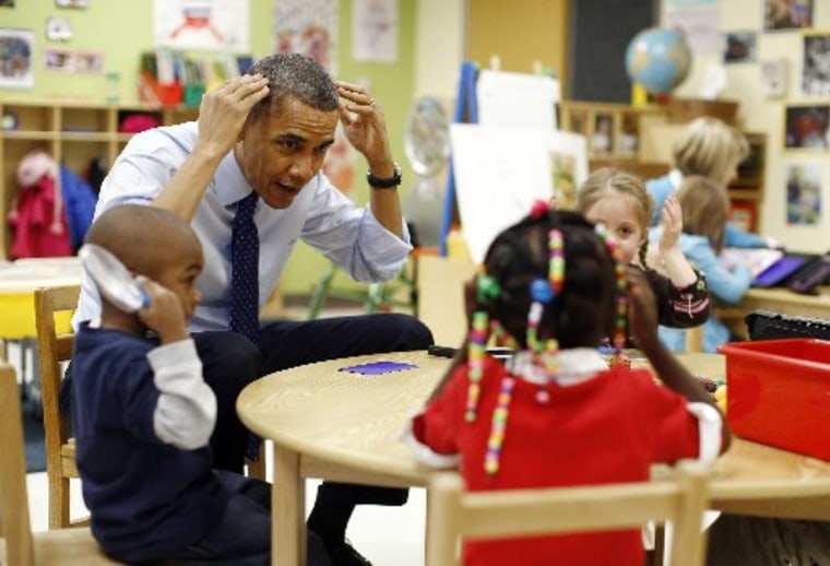 U.S. President Barack Obama plays a game with children in a pre-kindergarten classroom at College Heights early childhood learning center in Decatur February 14, 2013. Obama flew to Georgia to push his plan to ensure high-quality preschool, unveiled...