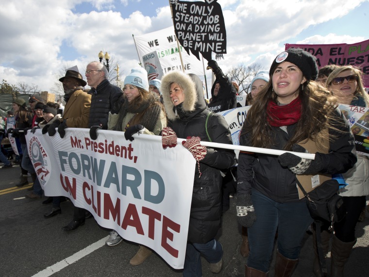 From center to right; Bill McKibben, Fiona McRaith, Leah Qusba and Maayan Cohen join a march from the National Mall to the White House in Washington during a rally on calling on President Barack Obama to reject the Keystone XL oil pipeline from Canada,...