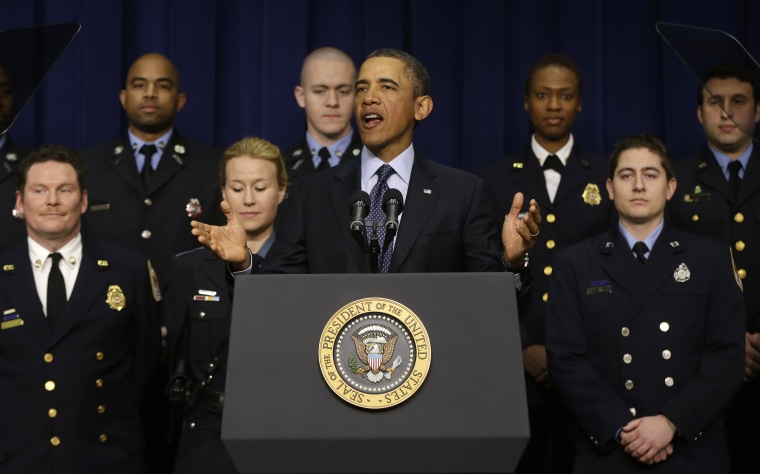 President Barack Obama, accompanied by emergency responders, a group of workers the White House says could be affected by the sequester cuts. (AP Photo/Charles Dharapak)